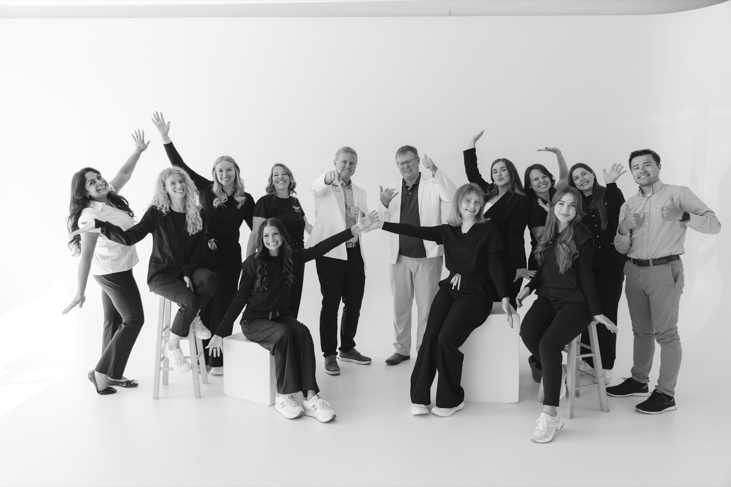 The Top Gum Dental team together in black and white